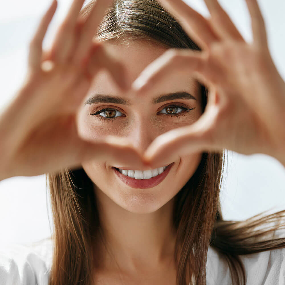 Woman Making a Heart Shape with Her Hands